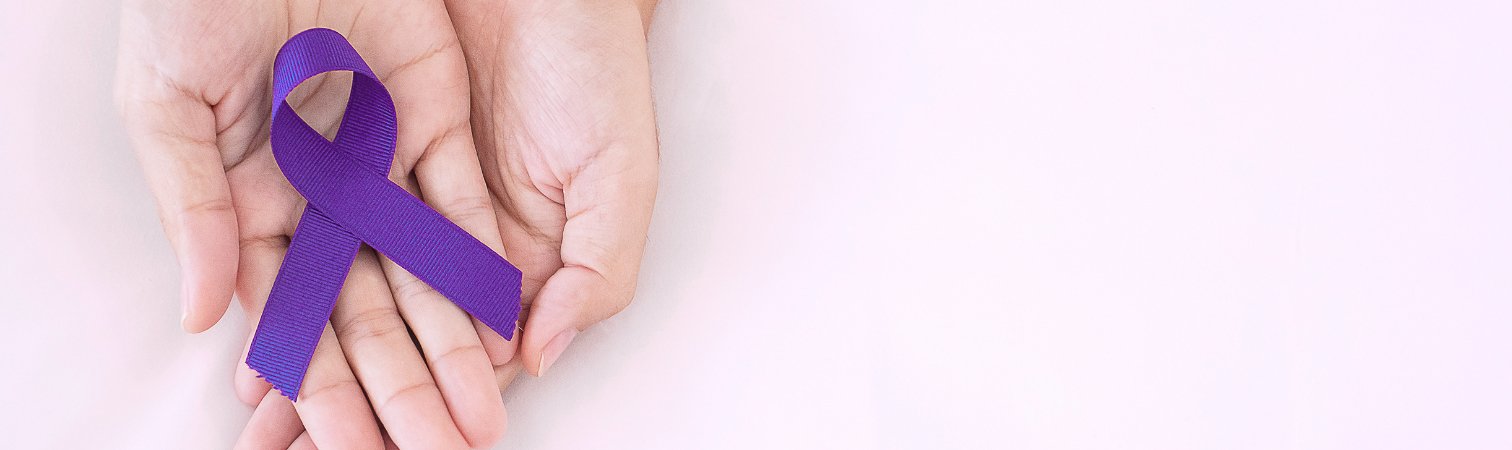 A purple ribbon signifying awareness of chronic condition in the palm of two hands.